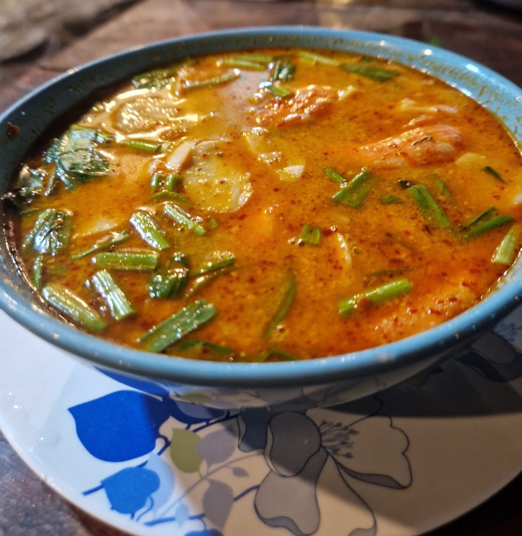 A bowl of spiced tomato soup with greens from the Root2Shoot café kitchen in Stockport